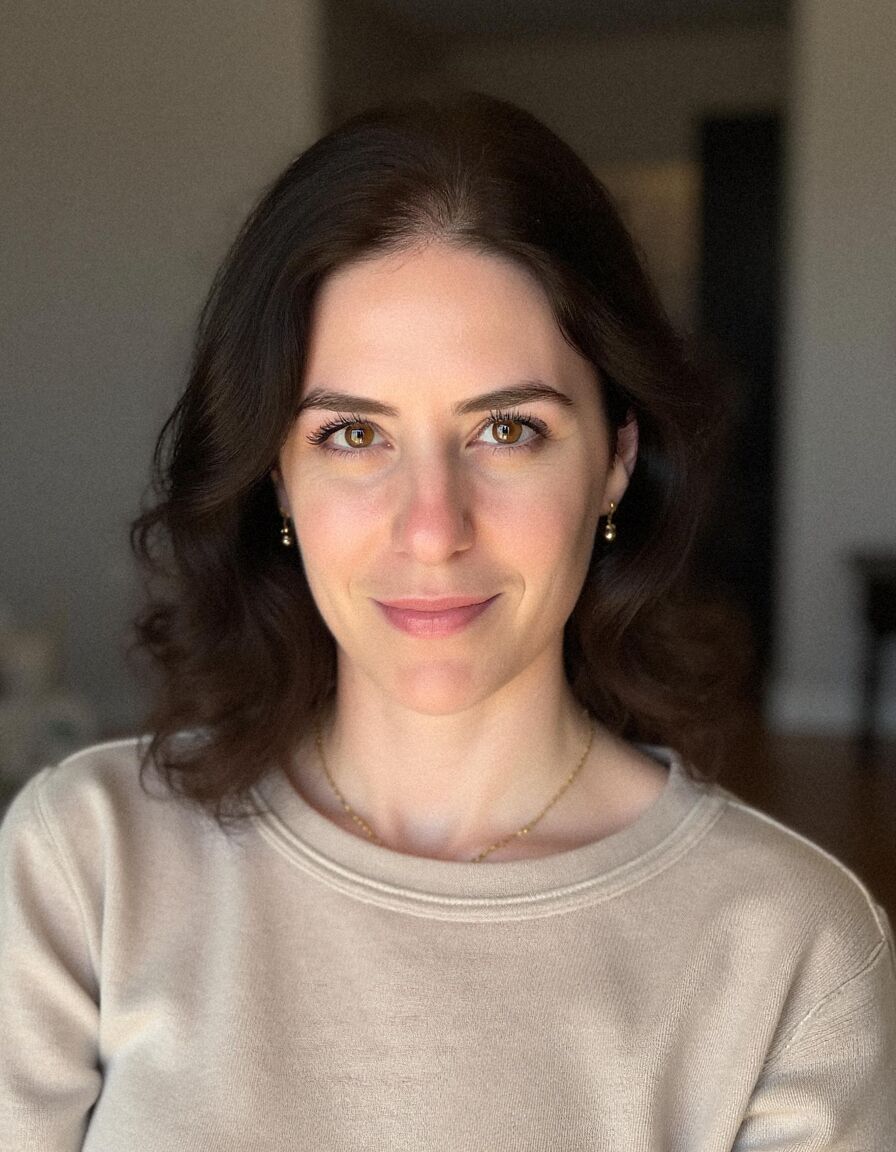AI headshot of Leila: office, beige jumper