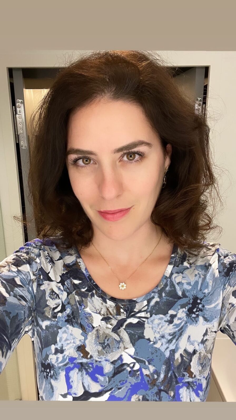 Leila's own selfie: selfie indoors in a floral top